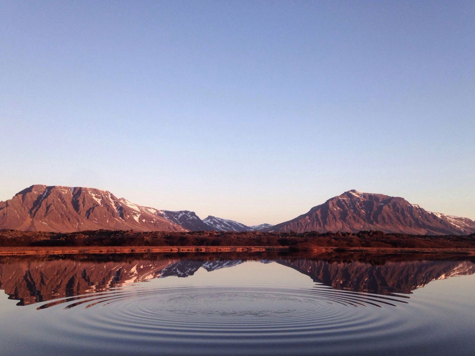 Southern Alps reflected in a clear alpine lake